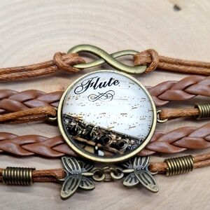 Boho Infinity "Flute" Charm Bracelet – Vintage Bronze & Faux Leather
